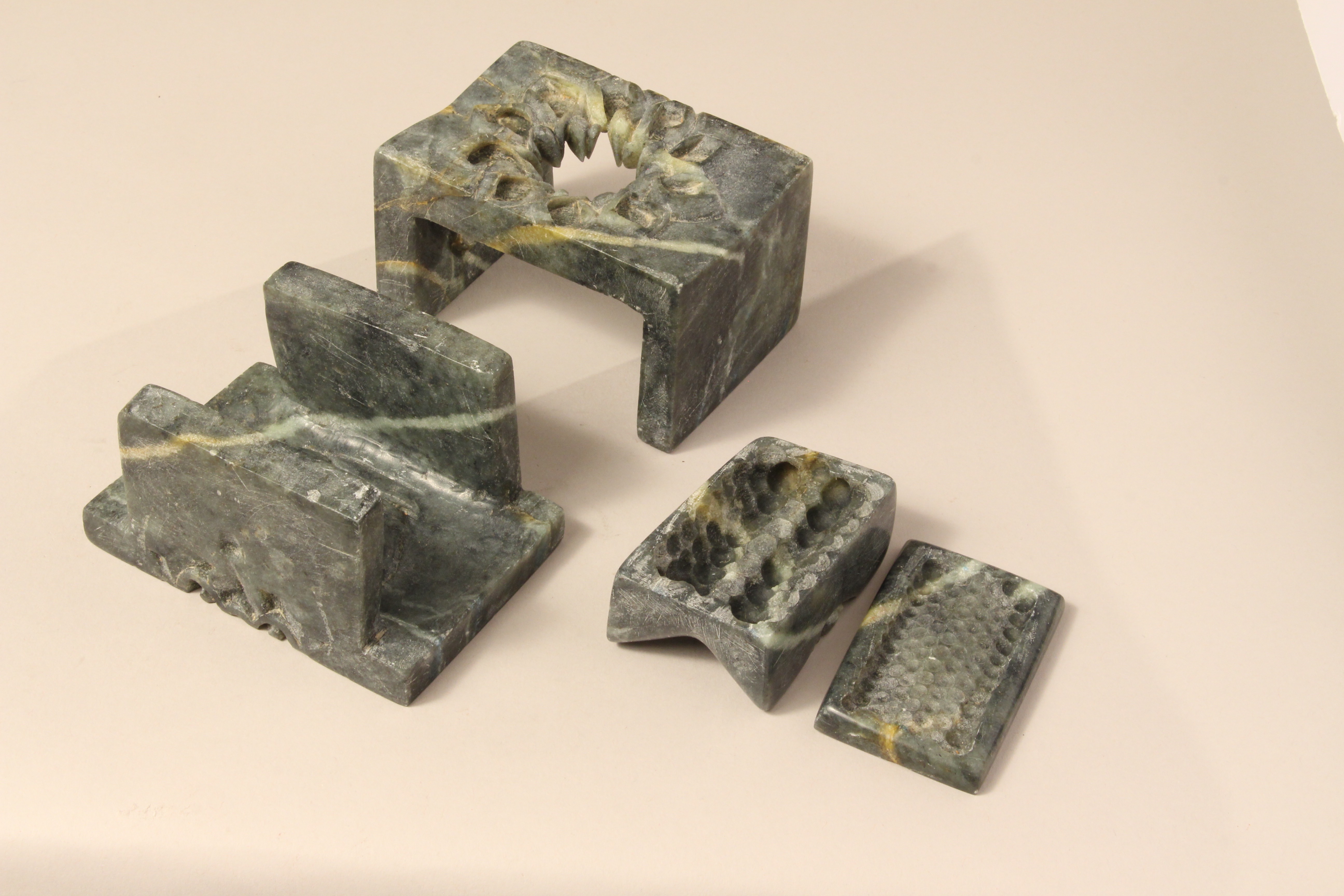 Hand carved soap stone in an intricate assembly that forms a box for a life-sized cicada