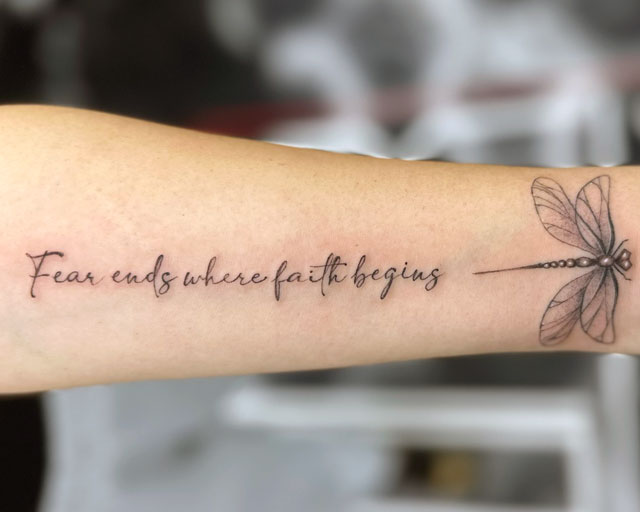 Lettering Font and Script Tattoo that says Fear ends where faith begins