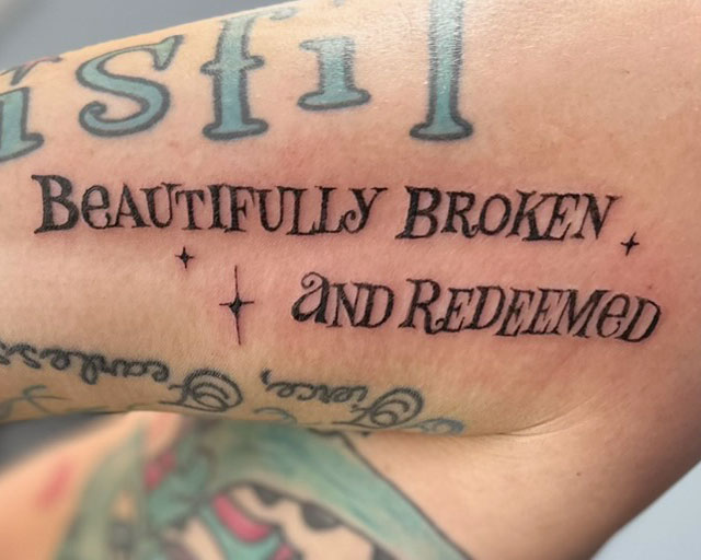 Lettering Font and Script Tattoo that says Beautifly Broken and Redeemed