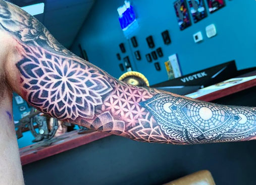 Video of inner arm of a full sleeve mandala-like tattoo