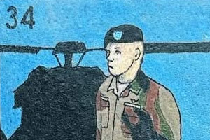 tattoo depicts a soldier in a Lotería style card, labeled 'El Soldado,' evoking themes of military service and cultural heritage.