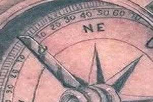  The tattoo depicts a detailed compass entwined with a thick rope on a person's chest.